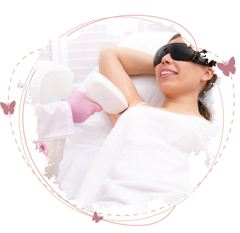 Under arm laser hair removal showing a smiling woman with protective eyewear receiving laser treatment on underarm